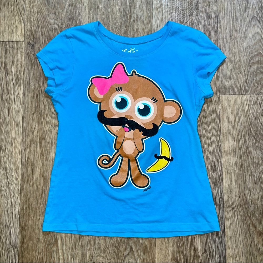 Justice monkey with a mustache graphic tee